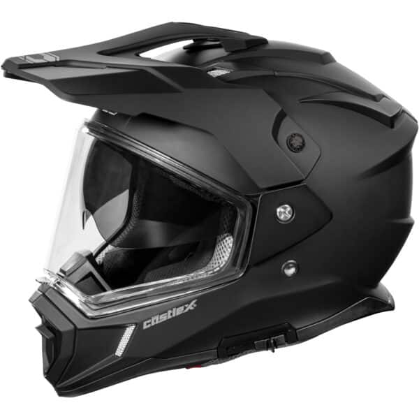 The CX200 Dual-Sport Motorcycle Helmet is matte black, full-face, with a clear visor, angular design, chin vent, a top peak, and "Castle X" branding on the side.