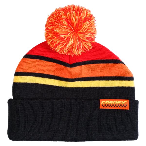 The Live Pom Beanie is a black beanie adorned with vibrant horizontal stripes in red, orange, and yellow. It features a playful red and orange pom-pom on top and an orange patch with text and a checkered pattern on the front cuff.