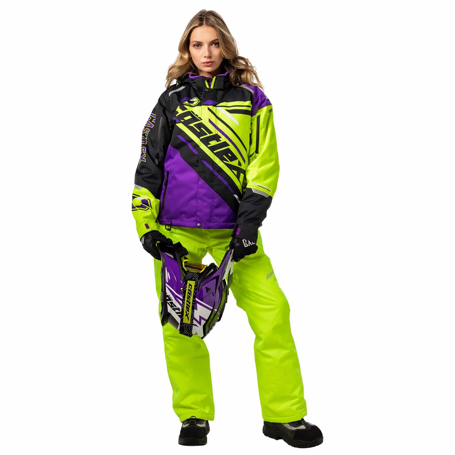 A vibrant snow jacket featuring bold geometric designs in black, blue, and pink. The jacket has a hood and several zippered pockets. The brand name "Castle" is prominently displayed on the chest and sleeve.