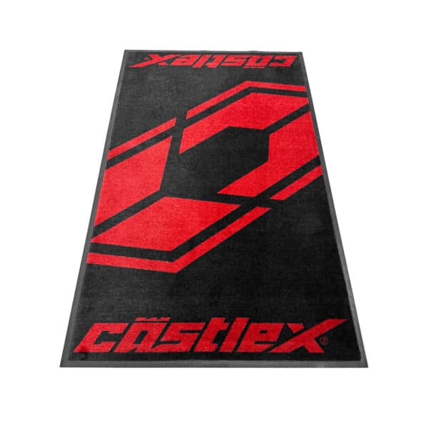 The Castle X Entry Rug is a rectangular black rug with a large red racing number 2 in the center and "Castlex" in stylized red at each end, with the furthest text upside down.